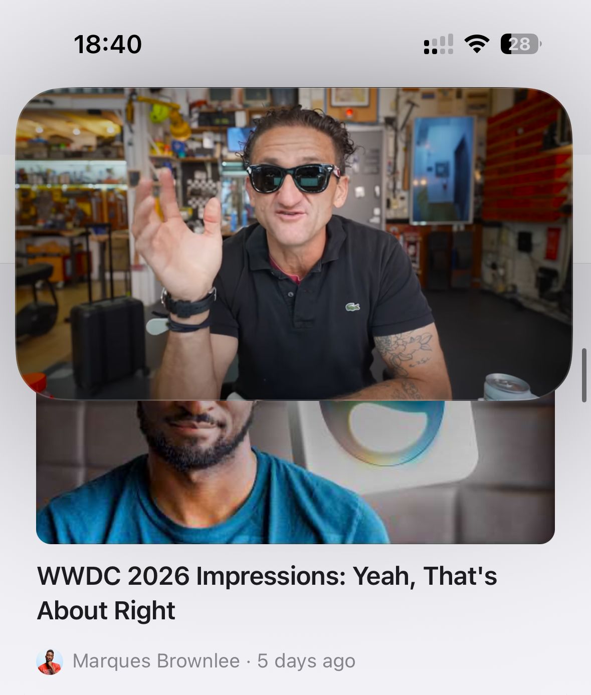 An iPhone showing the feed with a video playing picture-in-picture: a floating rounded window of a Casey Neistat video hovers over the page while the underlying video, WWDC 2026 Impressions by Marques Brownlee, plays inline below it
