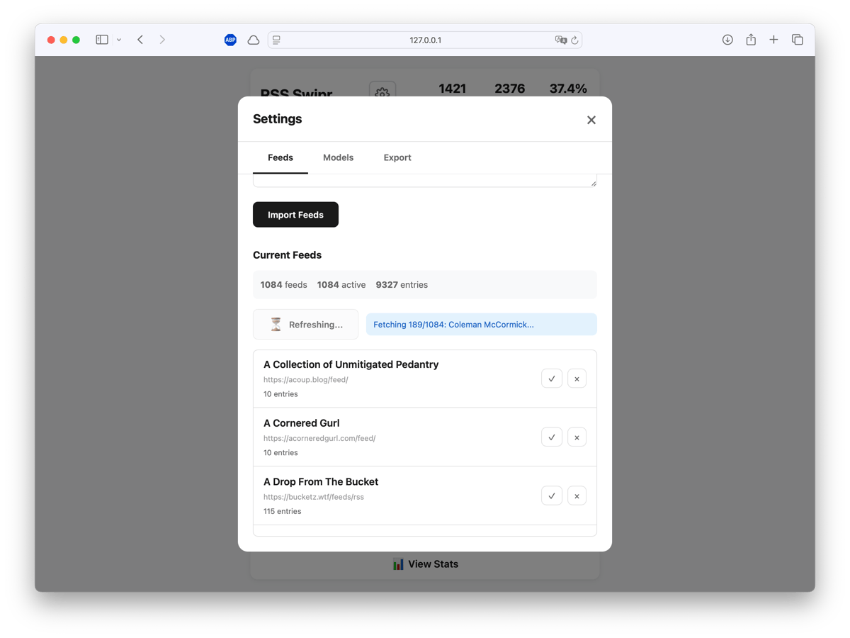 Feed management interface showing 1084 imported RSS feeds with 9327 total entries