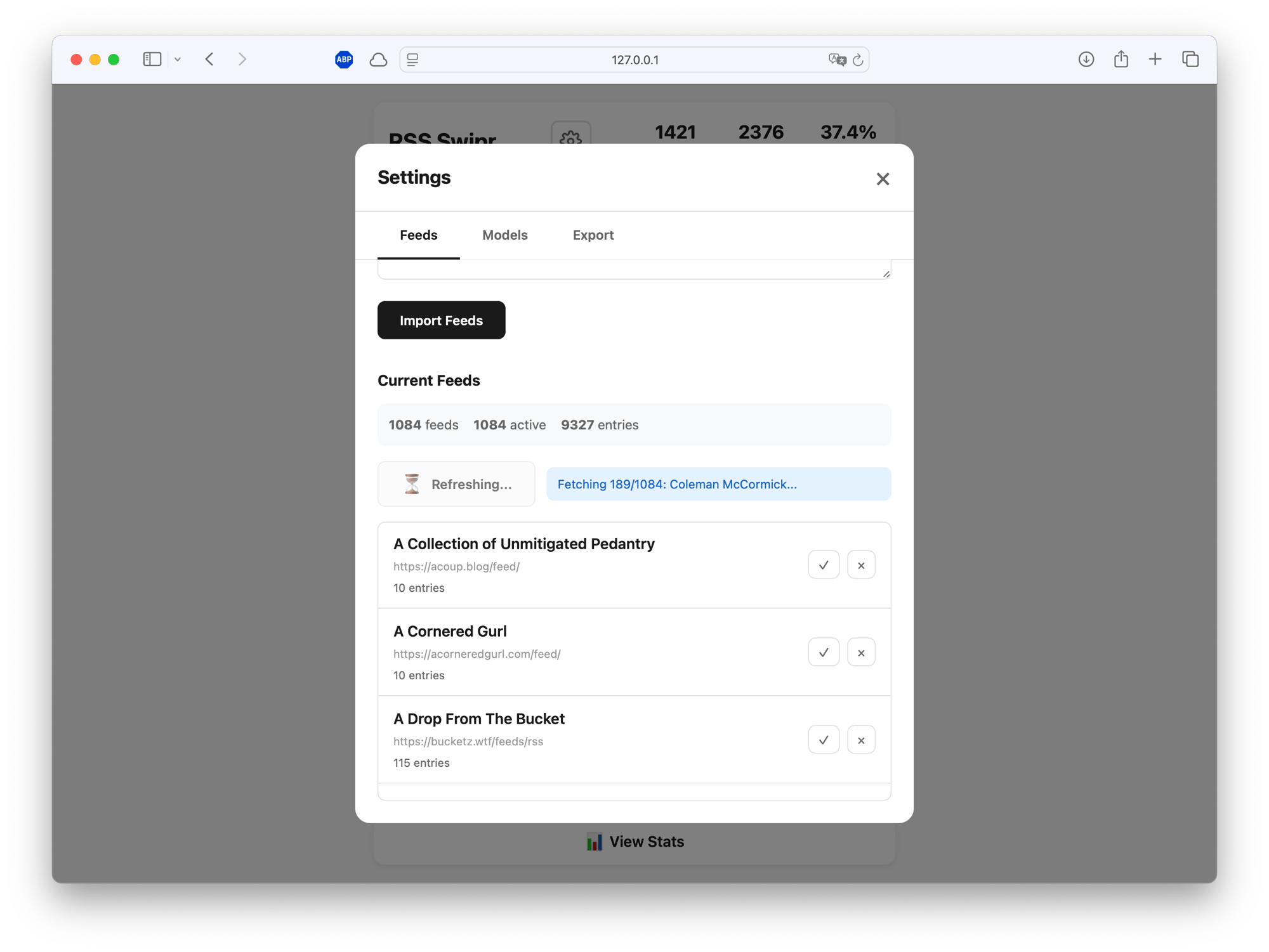 Feed management interface showing 1084 imported RSS feeds with 9327 total entries